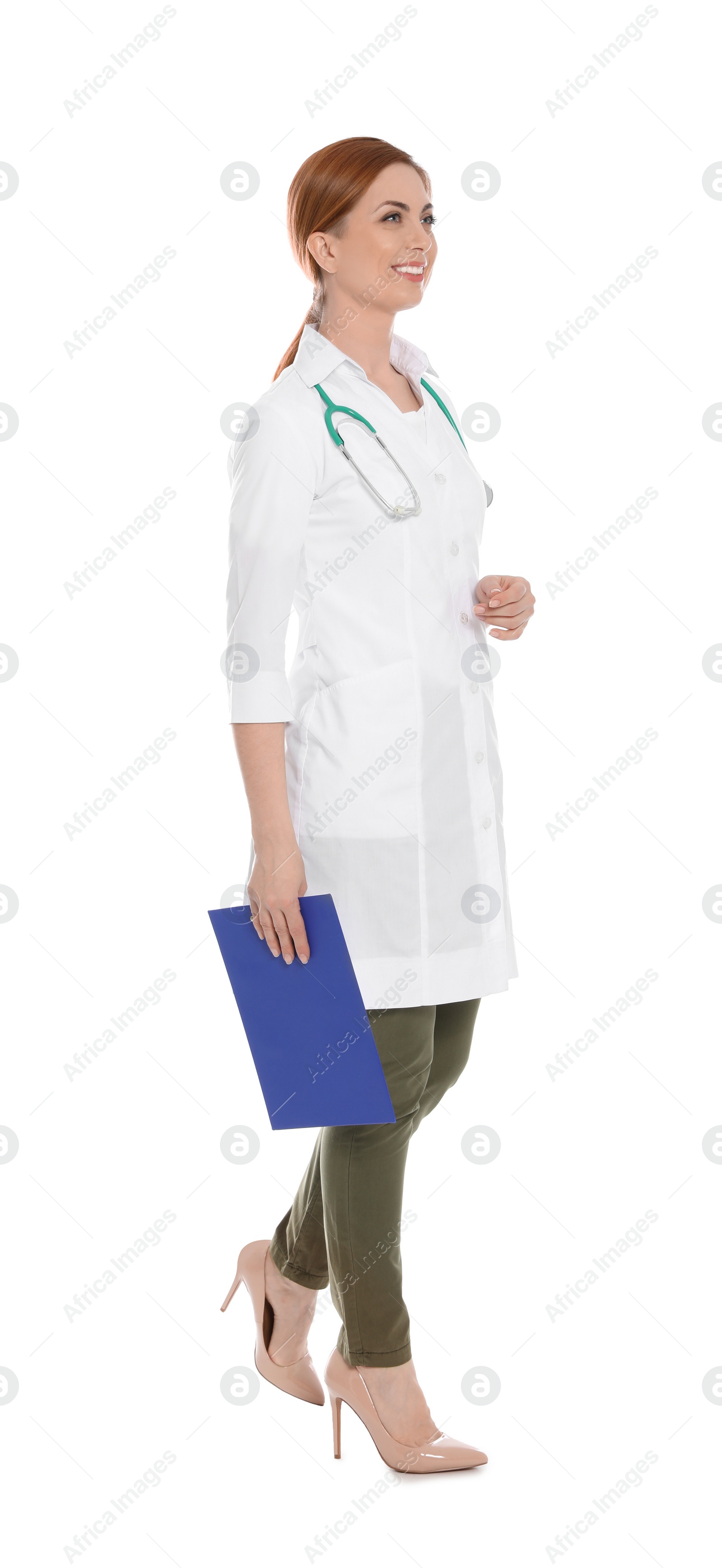 Photo of Full length portrait of medical doctor with clipboard and stethoscope isolated on white