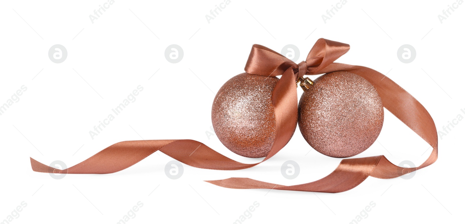 Photo of Beautiful coral Christmas balls with ribbon isolated on white