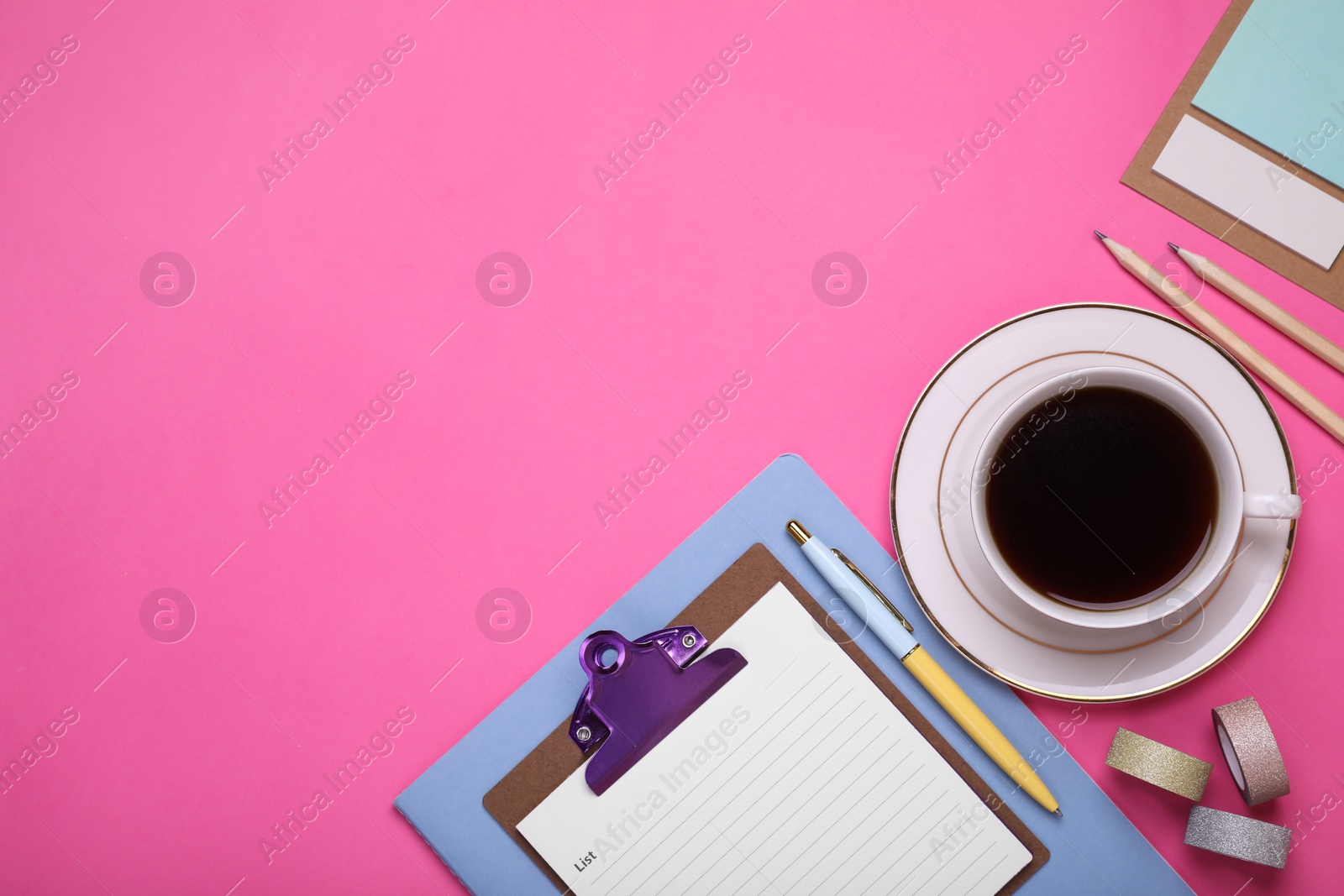 Photo of To do notes, stationery, planner and cup of coffee on pink background, flat lay. Space for text