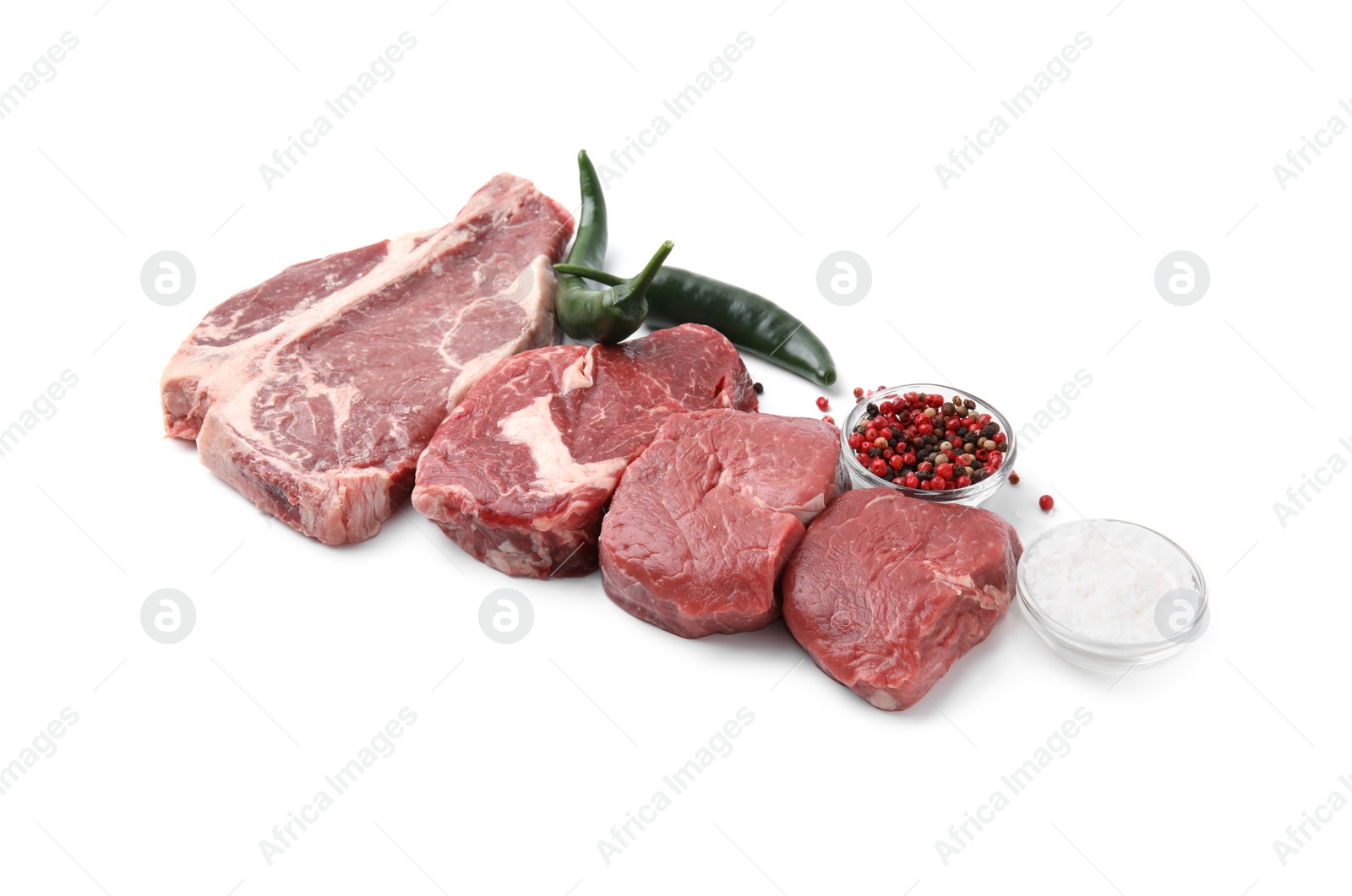 Photo of Cut fresh beef meat with spices isolated on white