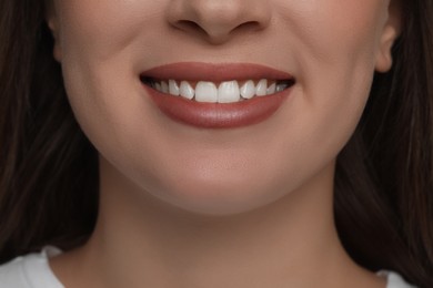 Photo of Young woman with healthy white teeth, closeup