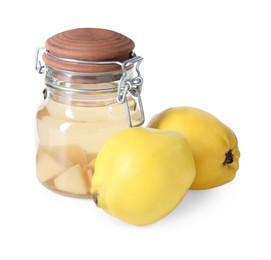 Delicious quince drink in glass jar and fresh fruits isolated on white