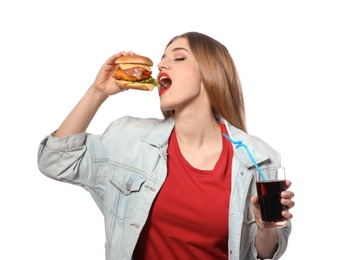Pretty woman with tasty burger and cola isolated on white
