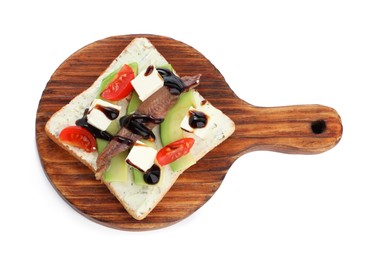 Photo of Delicious sandwich with anchovy, cheese, tomato and sauce on white background, top view