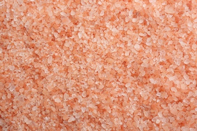 Pink himalayan salt as background, top view