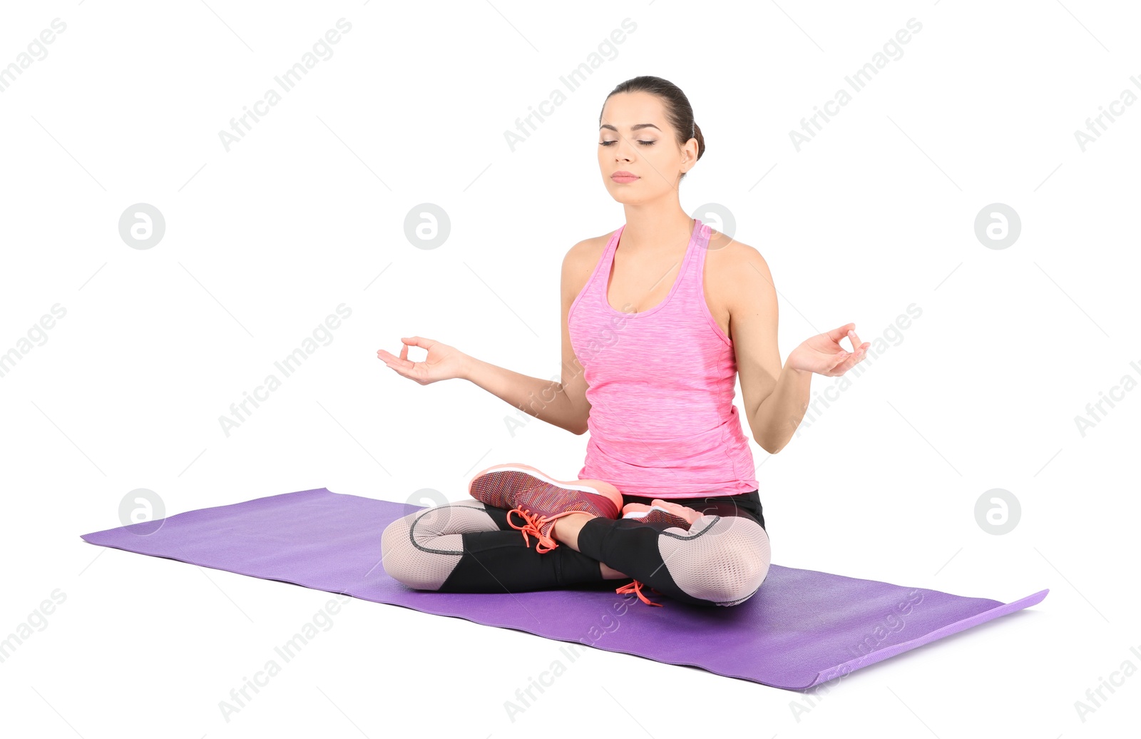 Photo of Young beautiful woman practicing yoga on white background. Home fitness