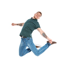 Handsome young man jumping on white background