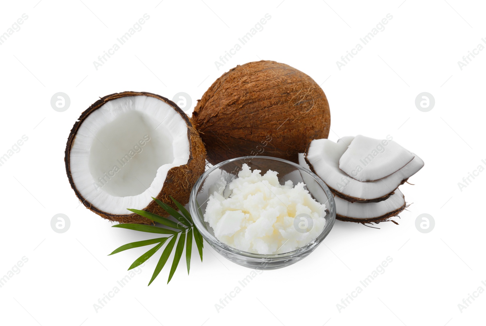 Photo of Organic coconut cooking oil, fresh fruits and leaf isolated on white