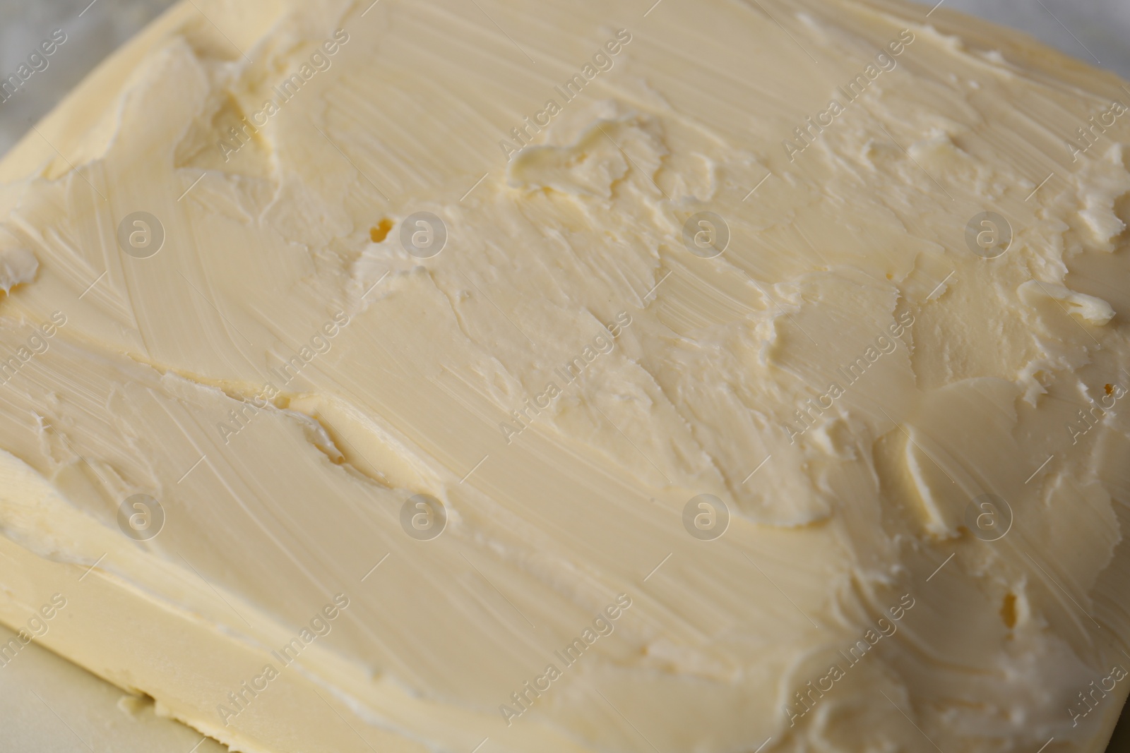 Photo of Piece of tasty homemade butter as background, closeup