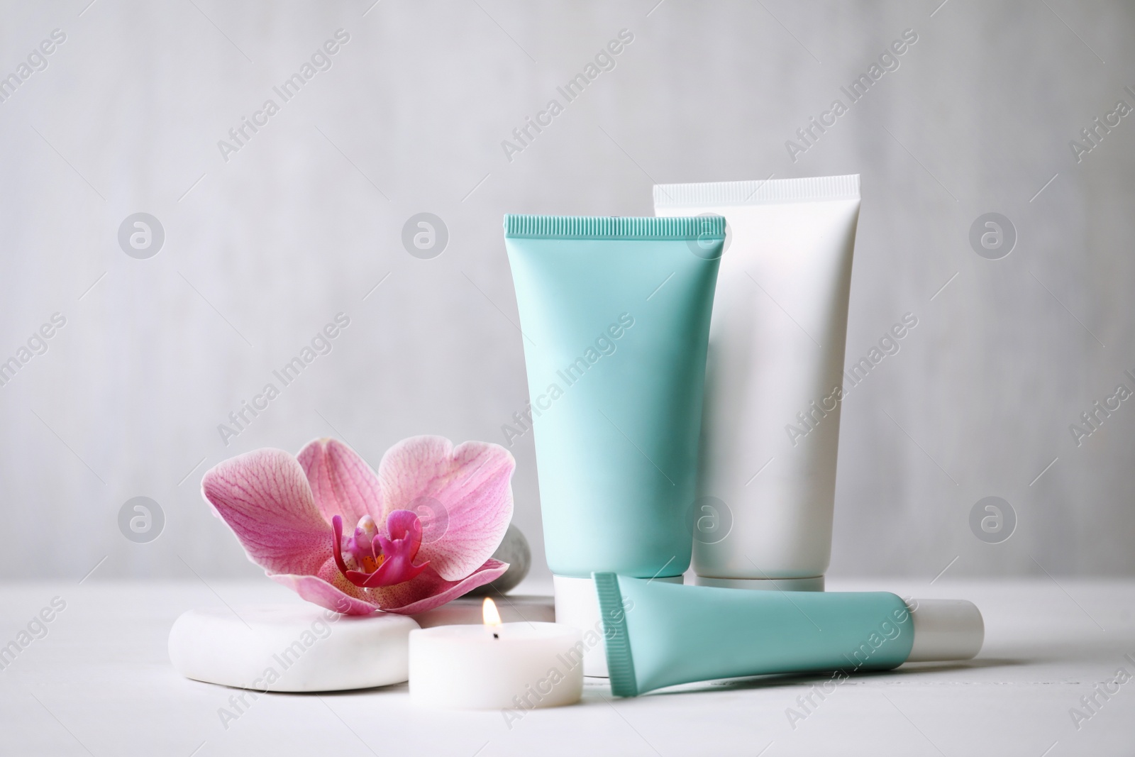 Photo of Composition with cosmetic products on white table