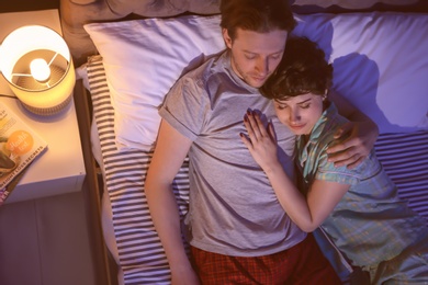 Young lovely couple sleeping in bed at home