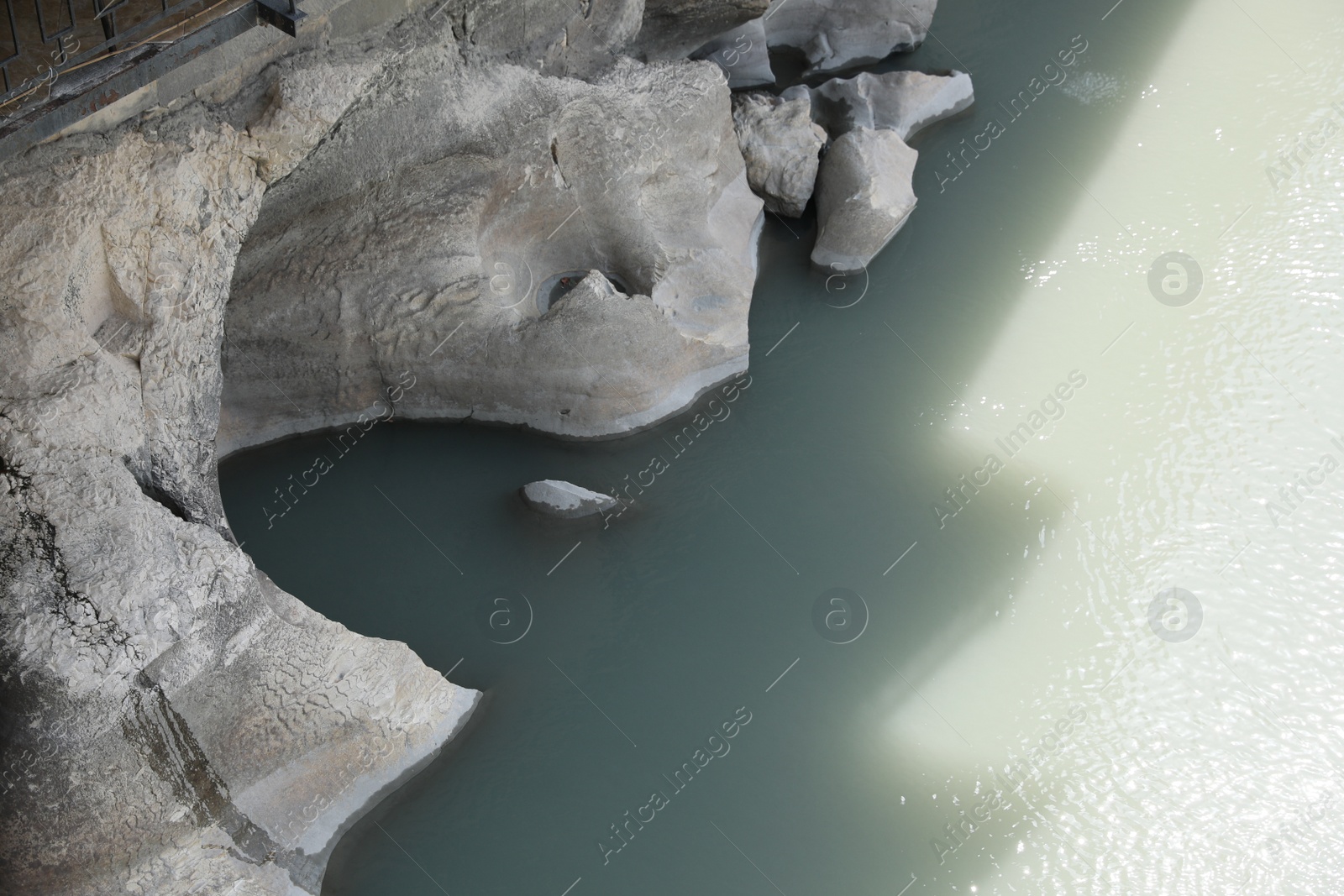 Photo of Picturesque view of clear river and rocks on sunny day