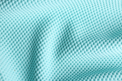 Photo of Textured light blue fabric as background, closeup