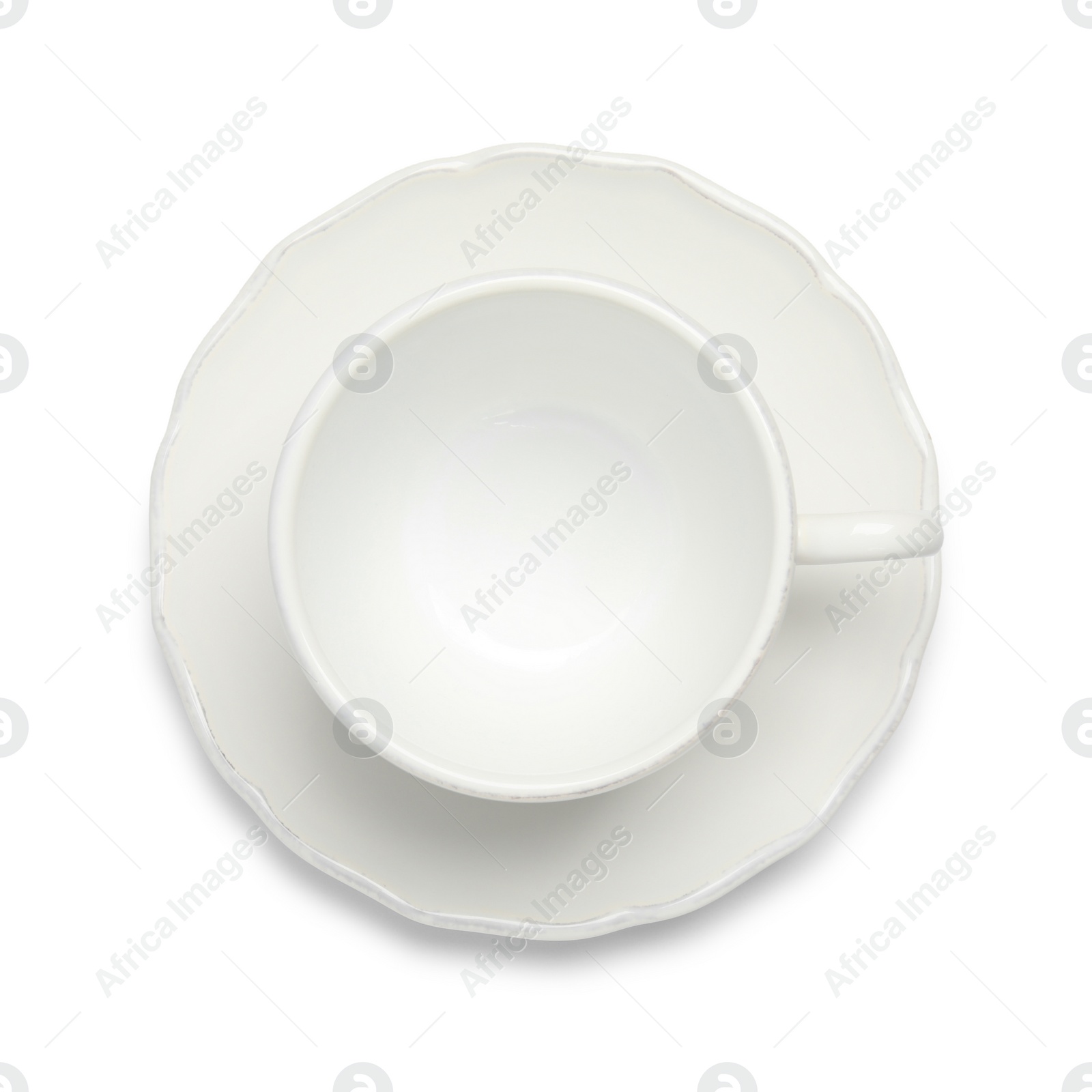 Photo of Empty ceramic cup and saucer isolated on white, top view