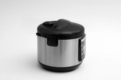Photo of Modern electric multi cooker on light background