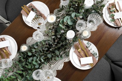 Photo of Luxury table setting with beautiful decor and blank cards, flat lay. Festive dinner