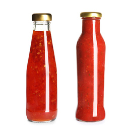 Image of Delicious sauces in glass bottles on white background
