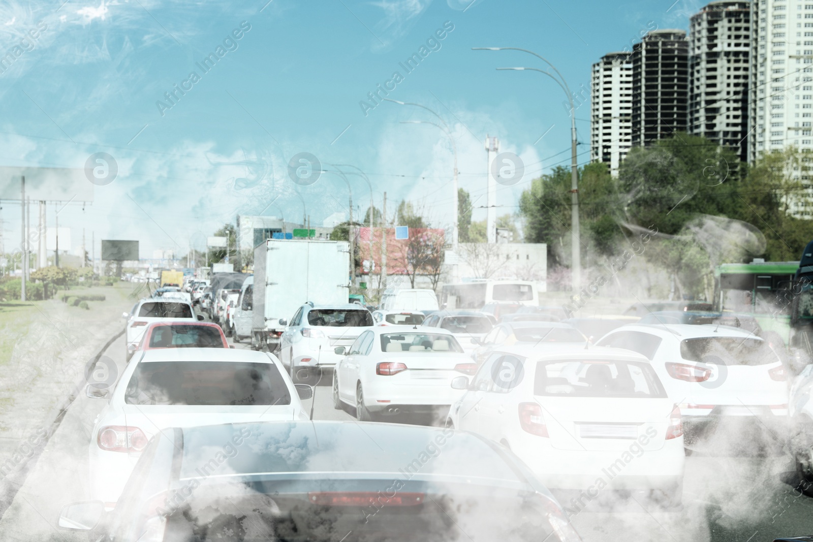 Image of Environmental pollution. Air contaminated with fumes in city. Cars surrounded by exhaust on road