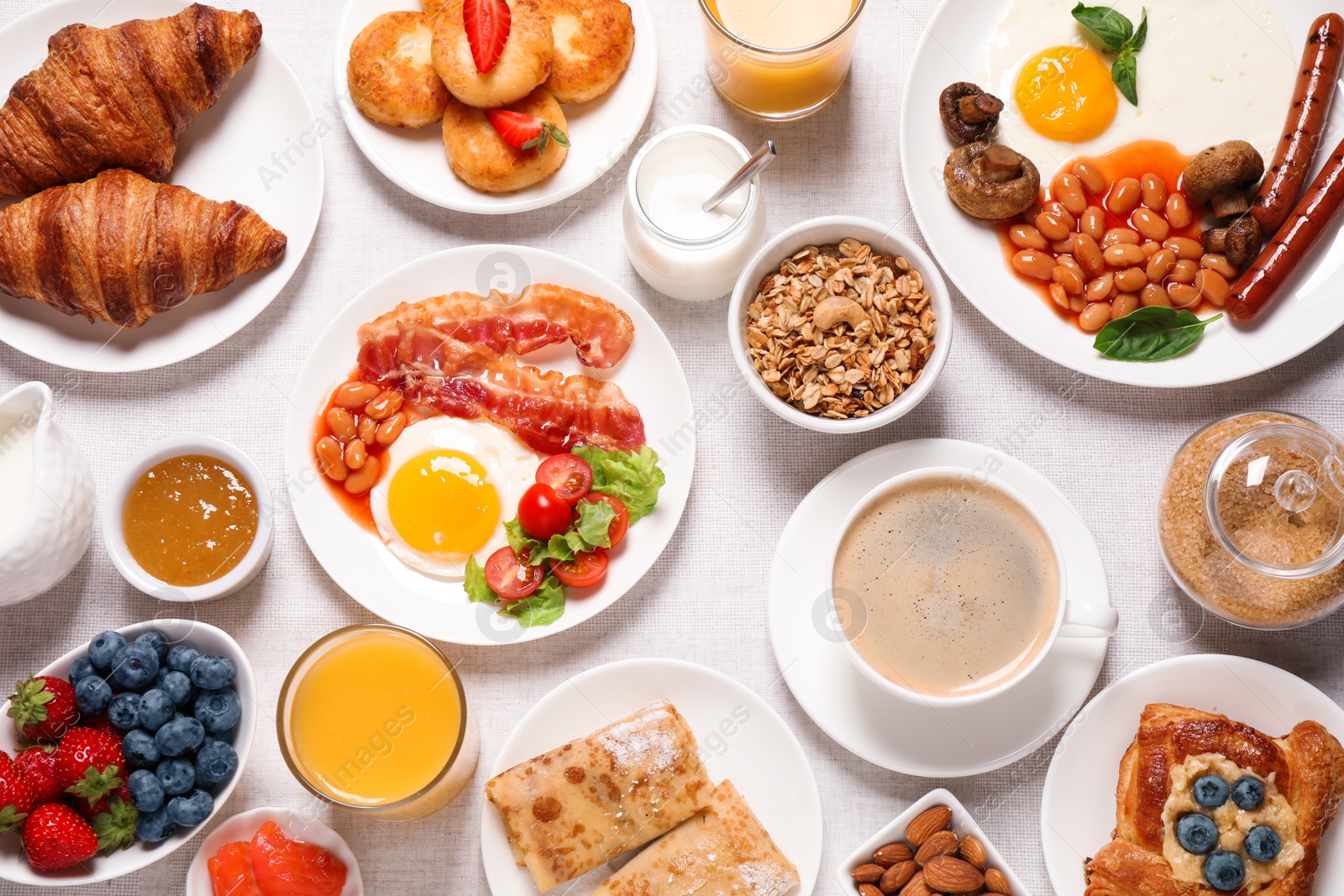 Photo of Buffet service. Tasty breakfast served on table, flat lay