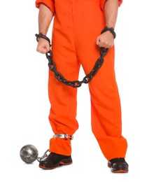 Photo of Prisoner in jumpsuit with chained hands and metal ball on white background, closeup
