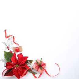 Photo of Flat lay composition with beautiful poinsettia and gift on white background, space for text. Christmas traditional flower