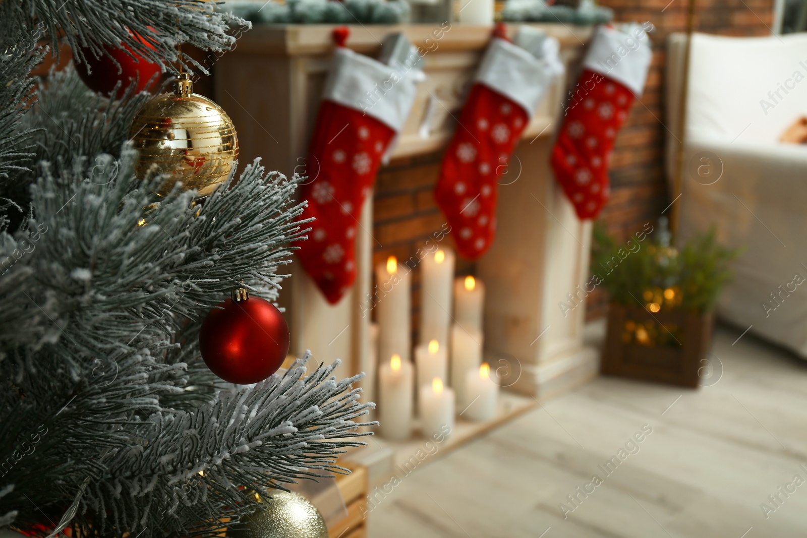 Photo of Blurred view of beautiful festive interior, focus on decorated Christmas tree