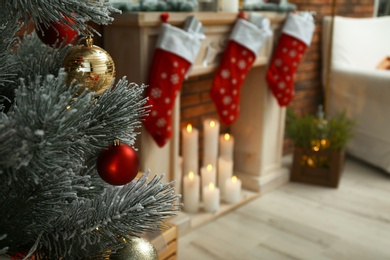 Blurred view of beautiful festive interior, focus on decorated Christmas tree