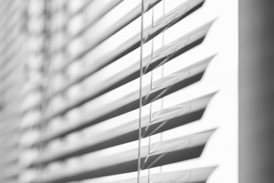 Photo of Closeup view of stylish horizontal window blinds