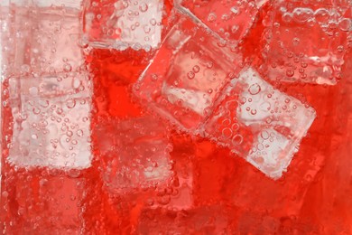 Photo of Closeup view of cold refreshing drink with ice in glass