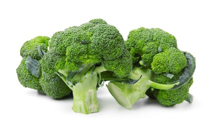 Photo of Pile of fresh raw green broccoli isolated on white