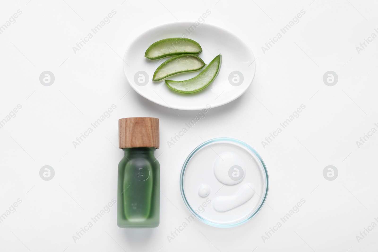 Photo of Cosmetic products and cut aloe leaves on white background, flat lay