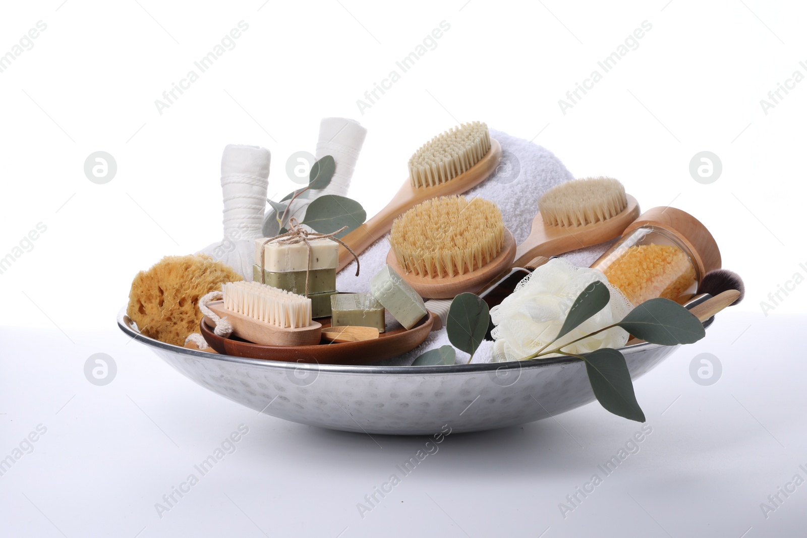 Photo of Different spa products and eucalyptus branches isolated on white