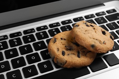 Chocolate chip cookies on laptop, closeup view