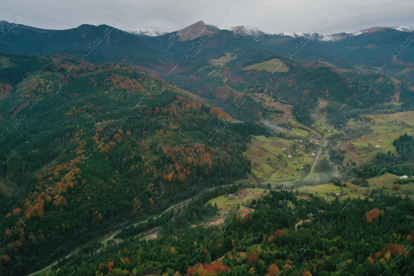 Photo of Aerial view of beautiful mountain village on cloudy day