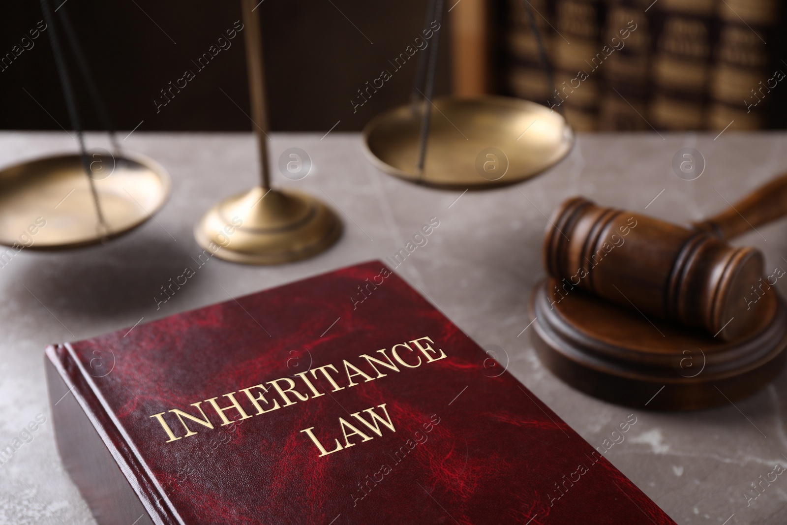 Image of Inheritance law and gavel on grey marble table, closeup
