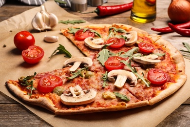 Hot delicious pizza baked in oven on table
