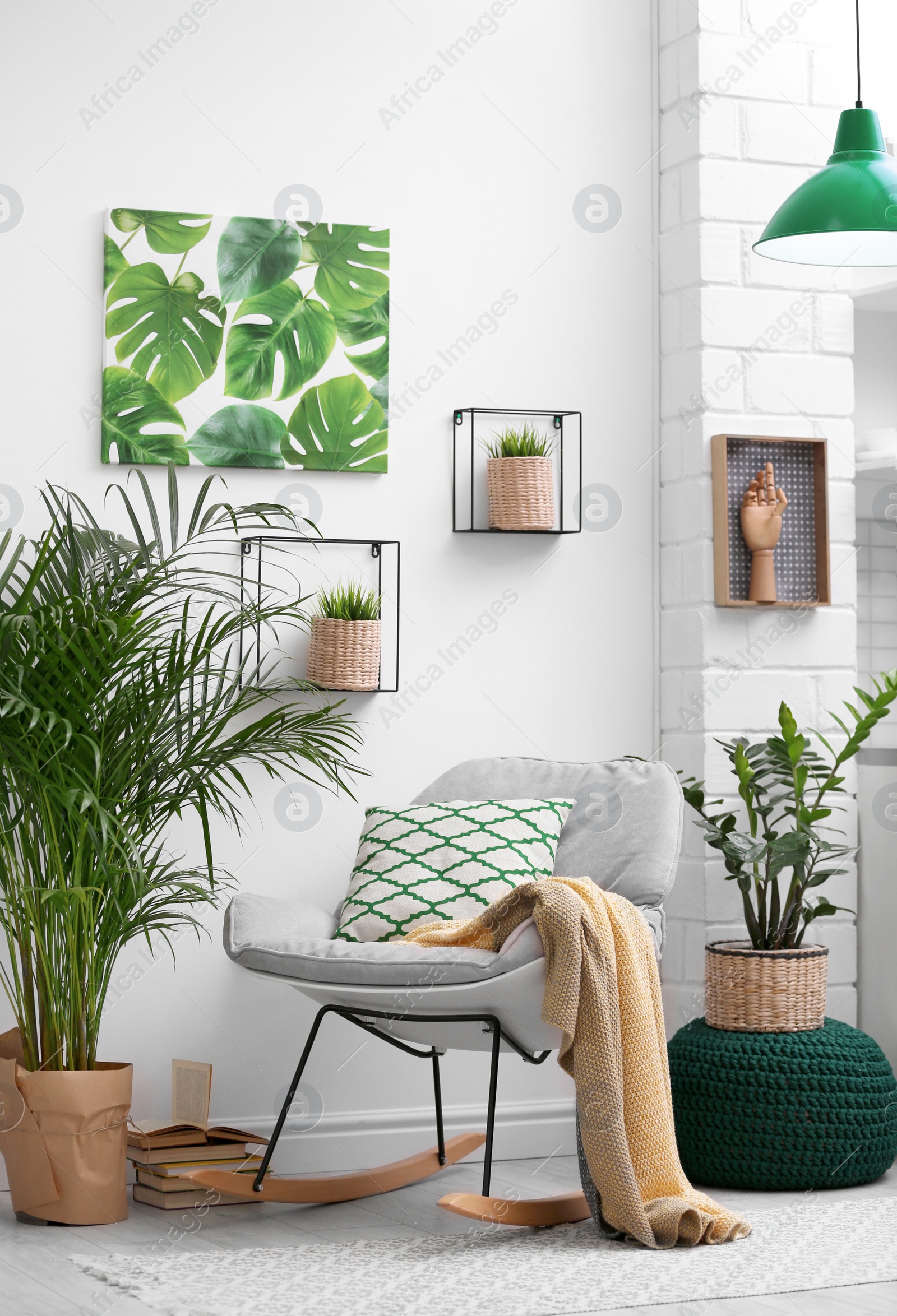 Photo of Stylish modern room interior with exotic houseplants