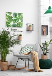 Photo of Stylish modern room interior with exotic houseplants