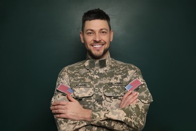 Portrait of happy cadet near chalkboard. Military education