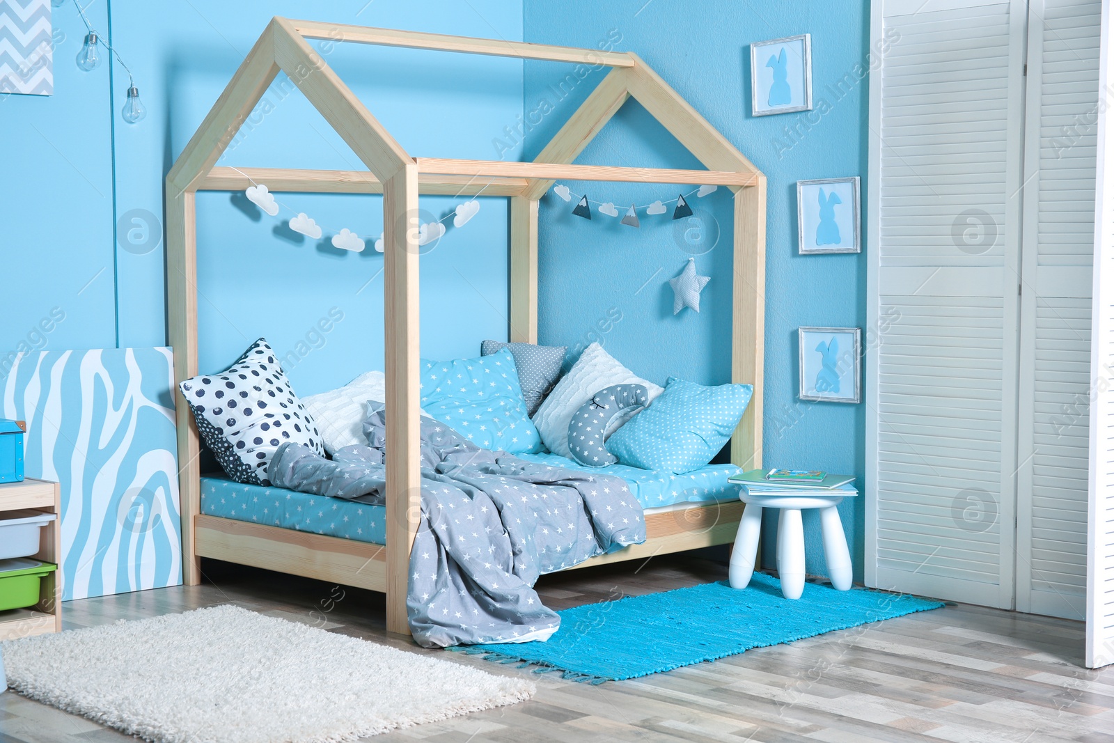 Photo of Comfortable bed in modern children room