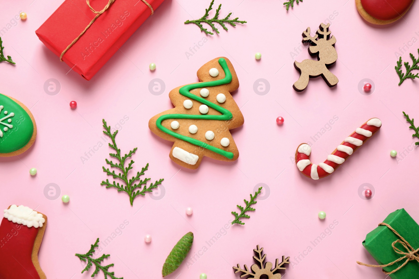 Photo of Flat lay composition with Christmas decorations on pink background