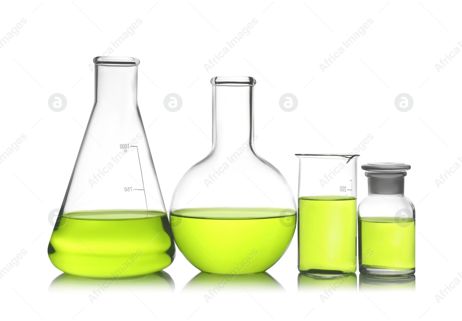 Photo of Laboratory glassware with color liquid on white background