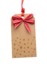 Photo of Cardboard gift tag with red bow isolated on white