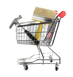 Photo of Small shopping cart with paint and renovation equipment isolated on white