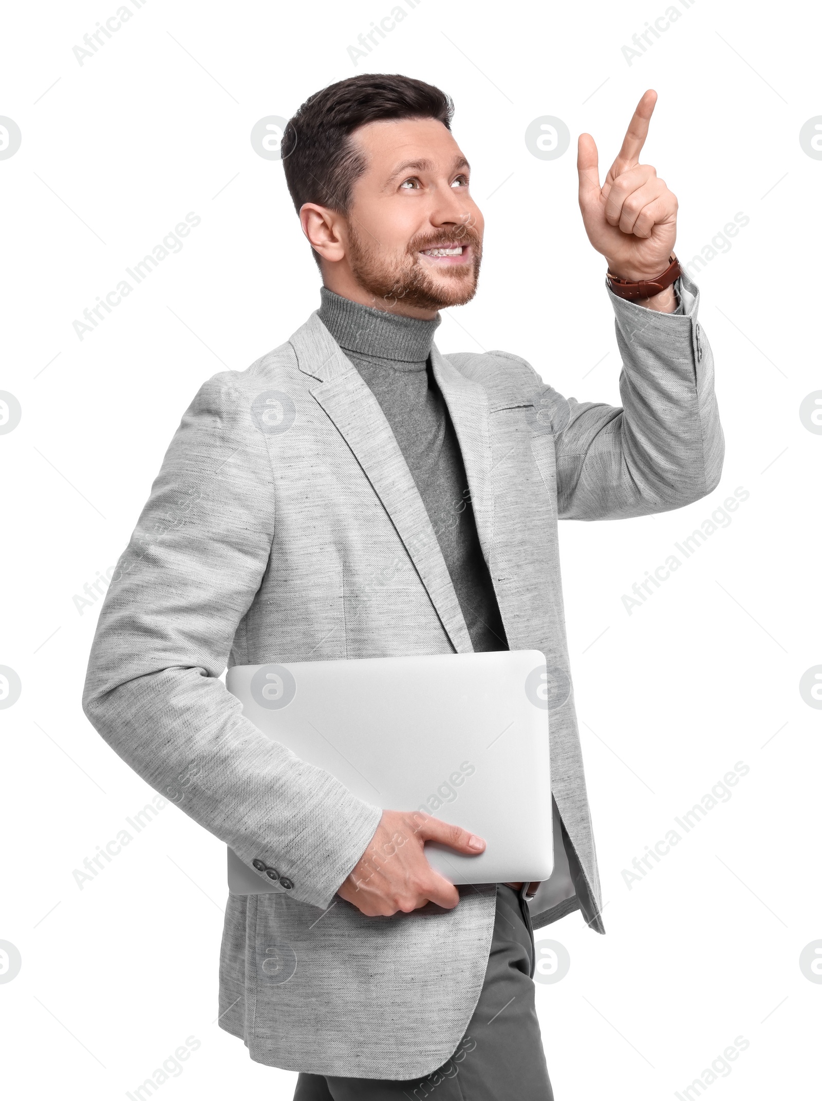 Photo of Handsome bearded businessman with tablet pointing at something on white background