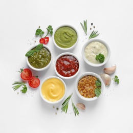 Composition with different sauces and ingredients on white background, flat lay