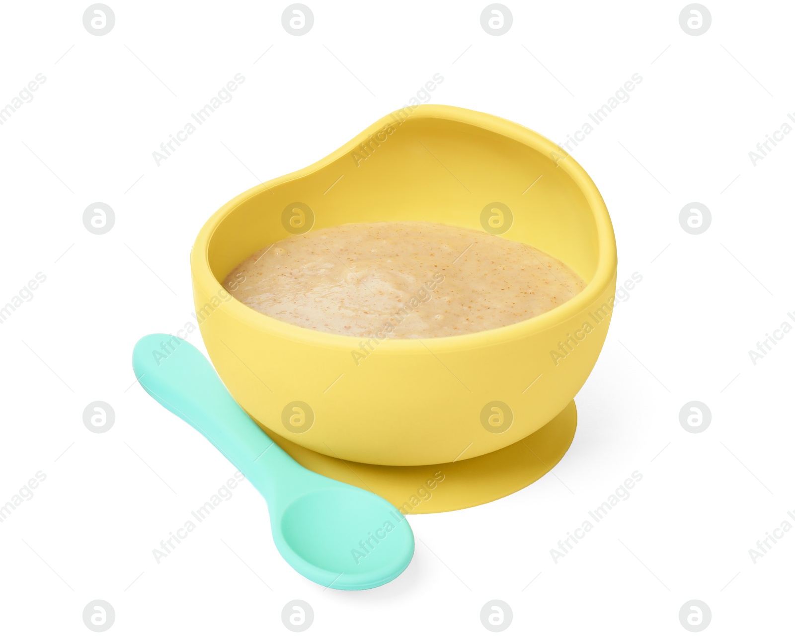Photo of Tasty baby food in bowl and spoon isolated on white