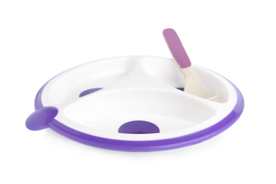 Plastic section plate with spoon isolated on white. Serving baby food