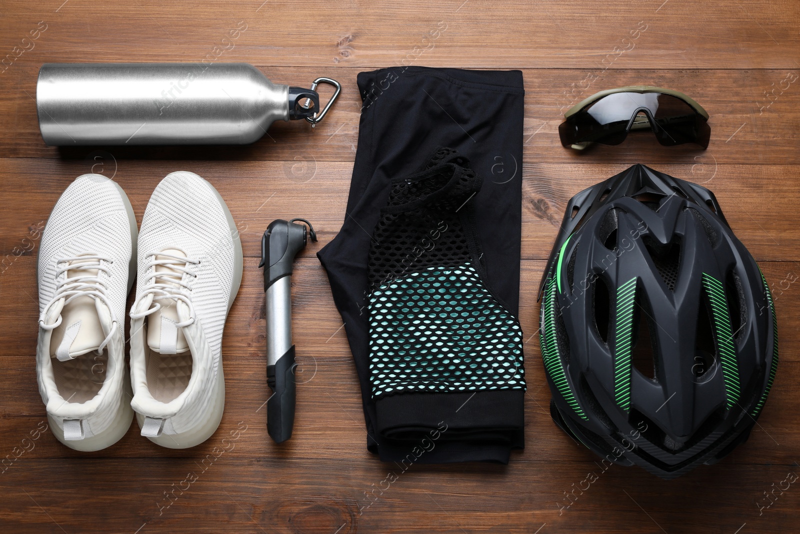 Photo of Flat lay composition with different cycling accessories on wooden background