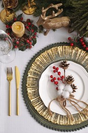 Photo of Luxury festive place setting with beautiful decor for Christmas dinner on white table, flat lay